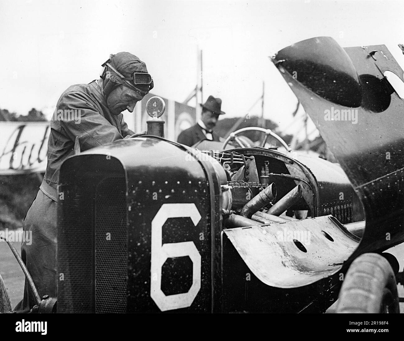 Gibbs at work on his Vauxhall engine during IOM TT 1914 Stock Photo