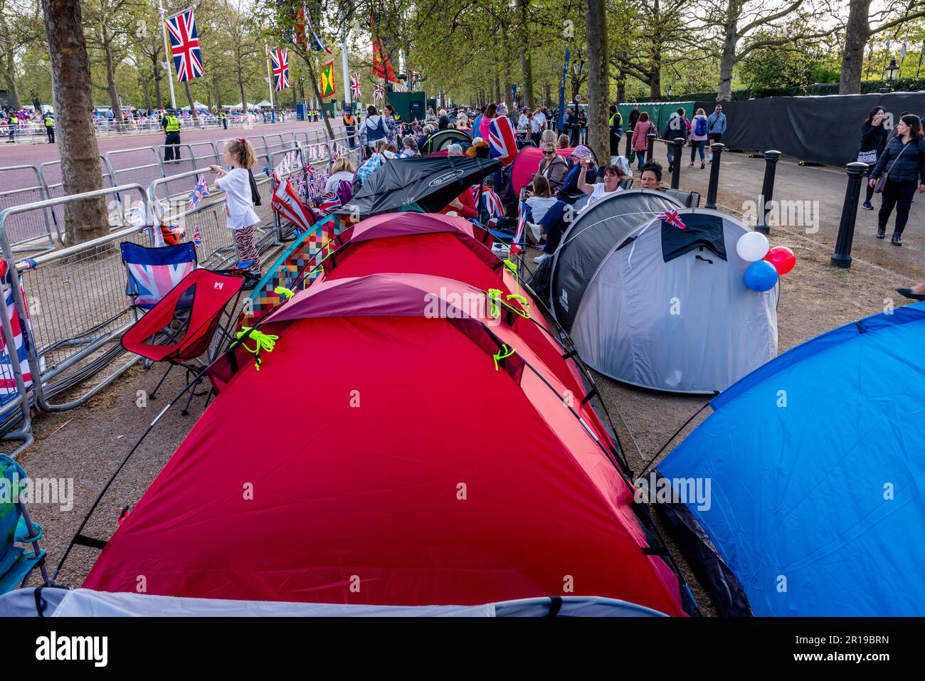 People Camp Out On The Mall To Watch The King's Procession The Day Before The Coronation of King Charles III, London, UK. Stock Photo