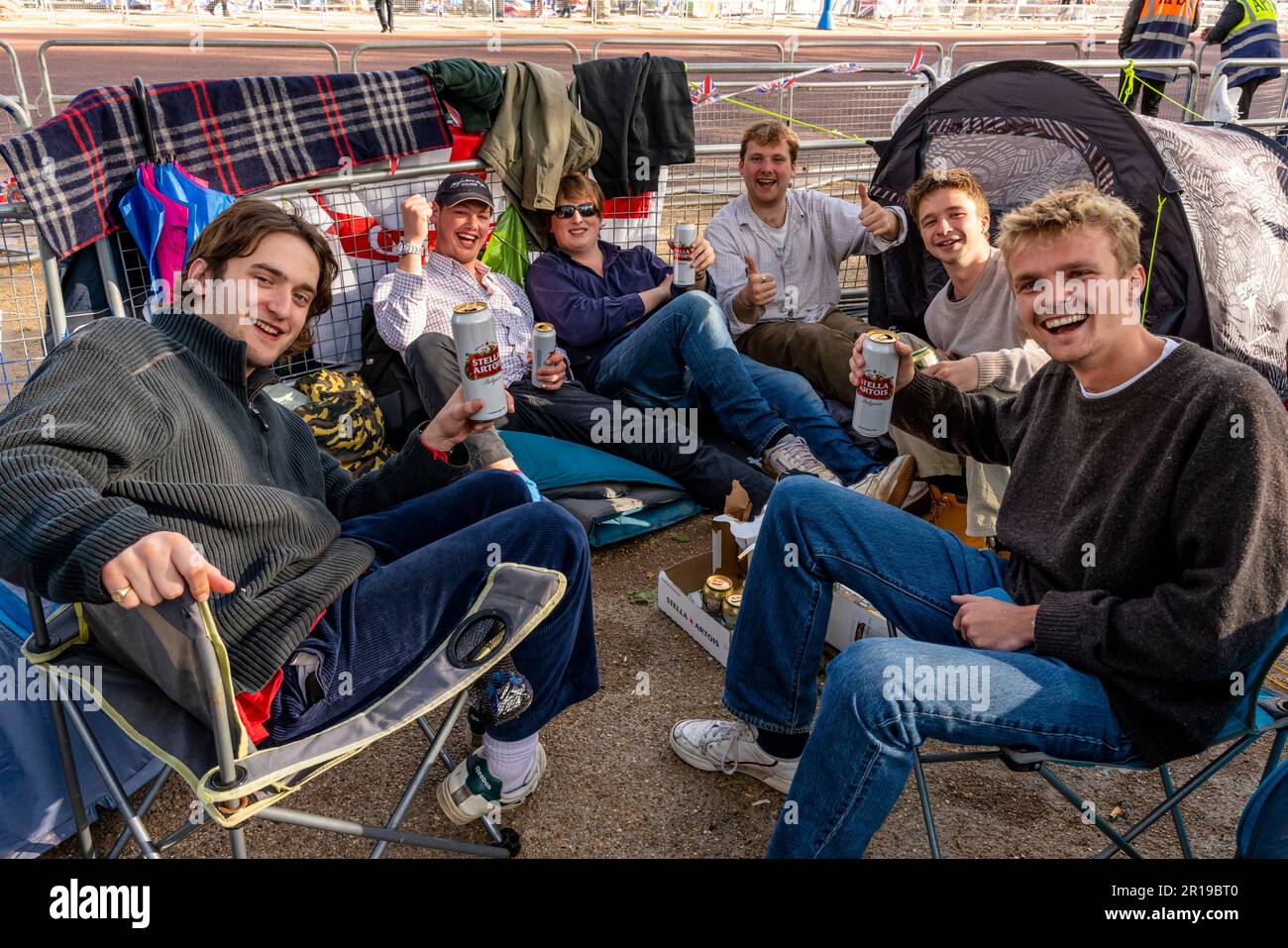 Young British People Camp Out On The Mall For The Coronation of King Charles III, London, UK. Stock Photo