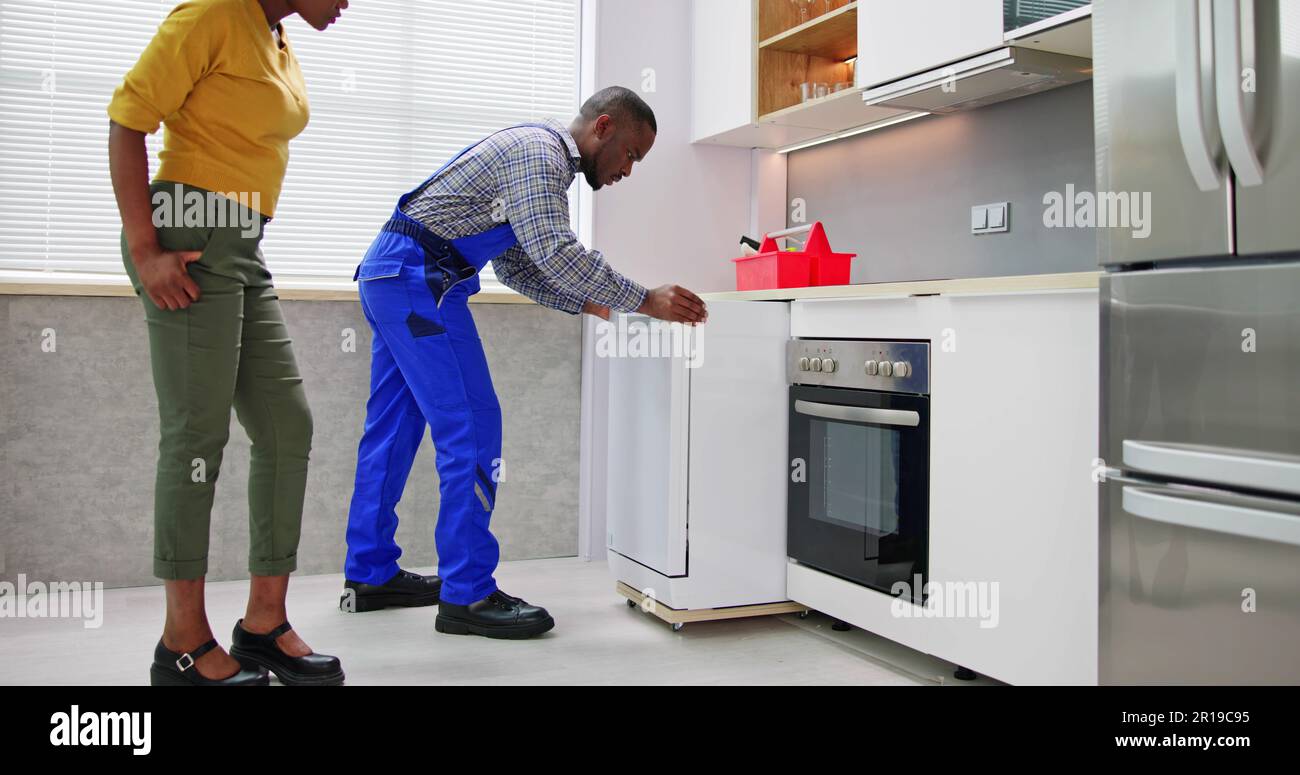 Dishwasher Install And Repair. Appliance Service Problem Stock Photo