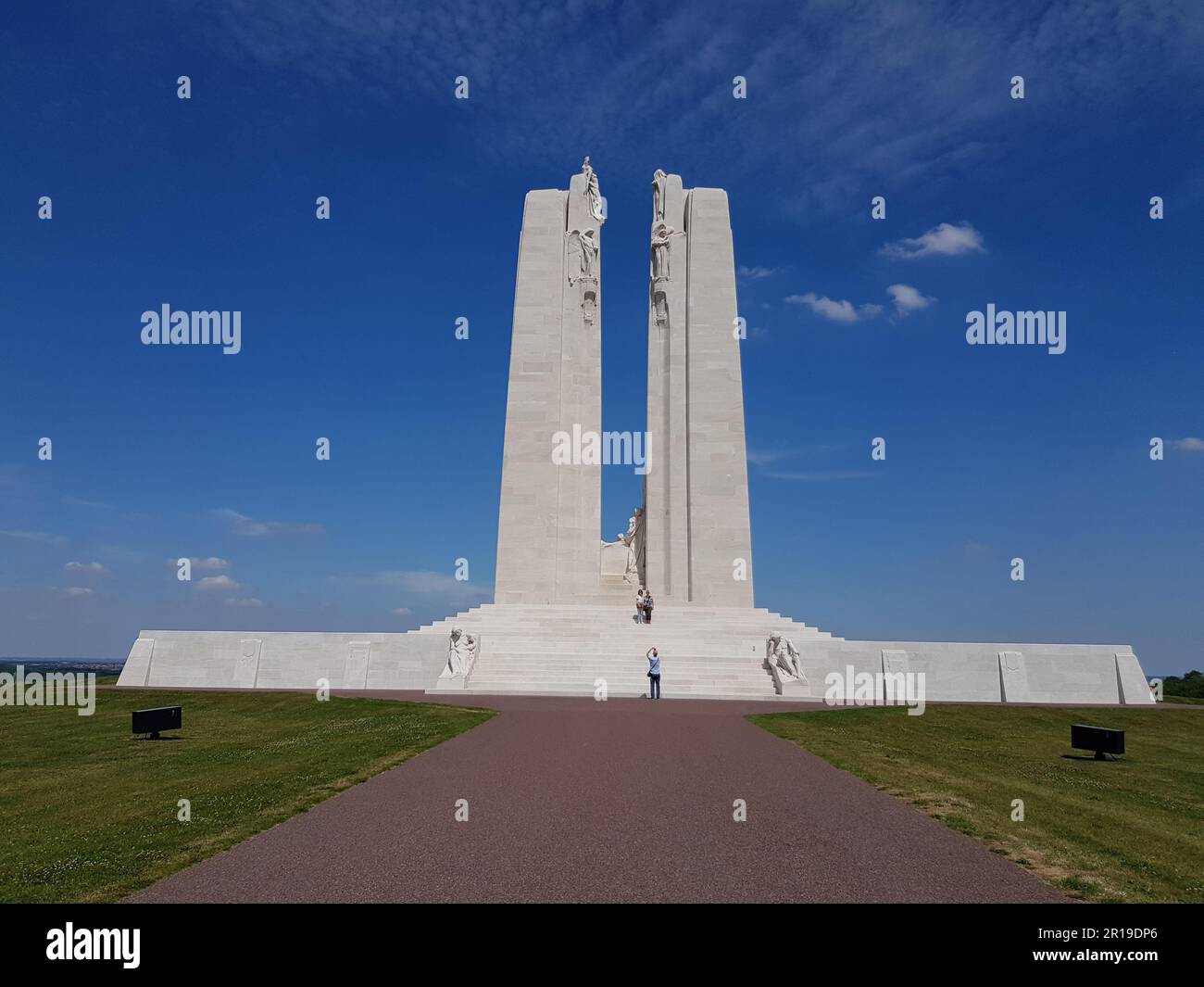 The white Vimy Ridge Canadian War Memorial against a blue sky with ...