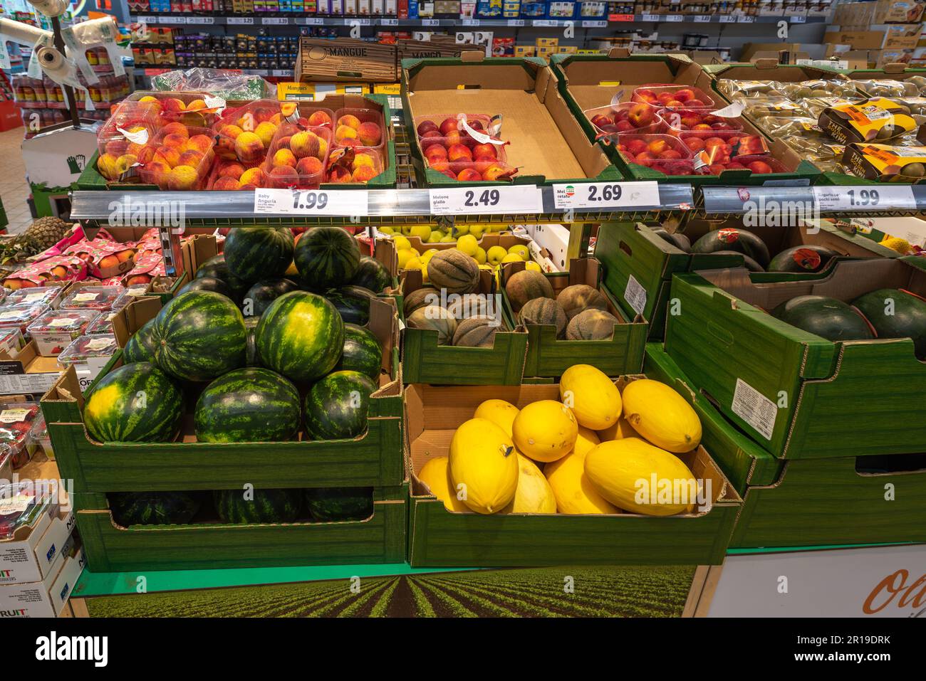 Italy - May 11, 2023: fruit, melons, peach watermelons in green