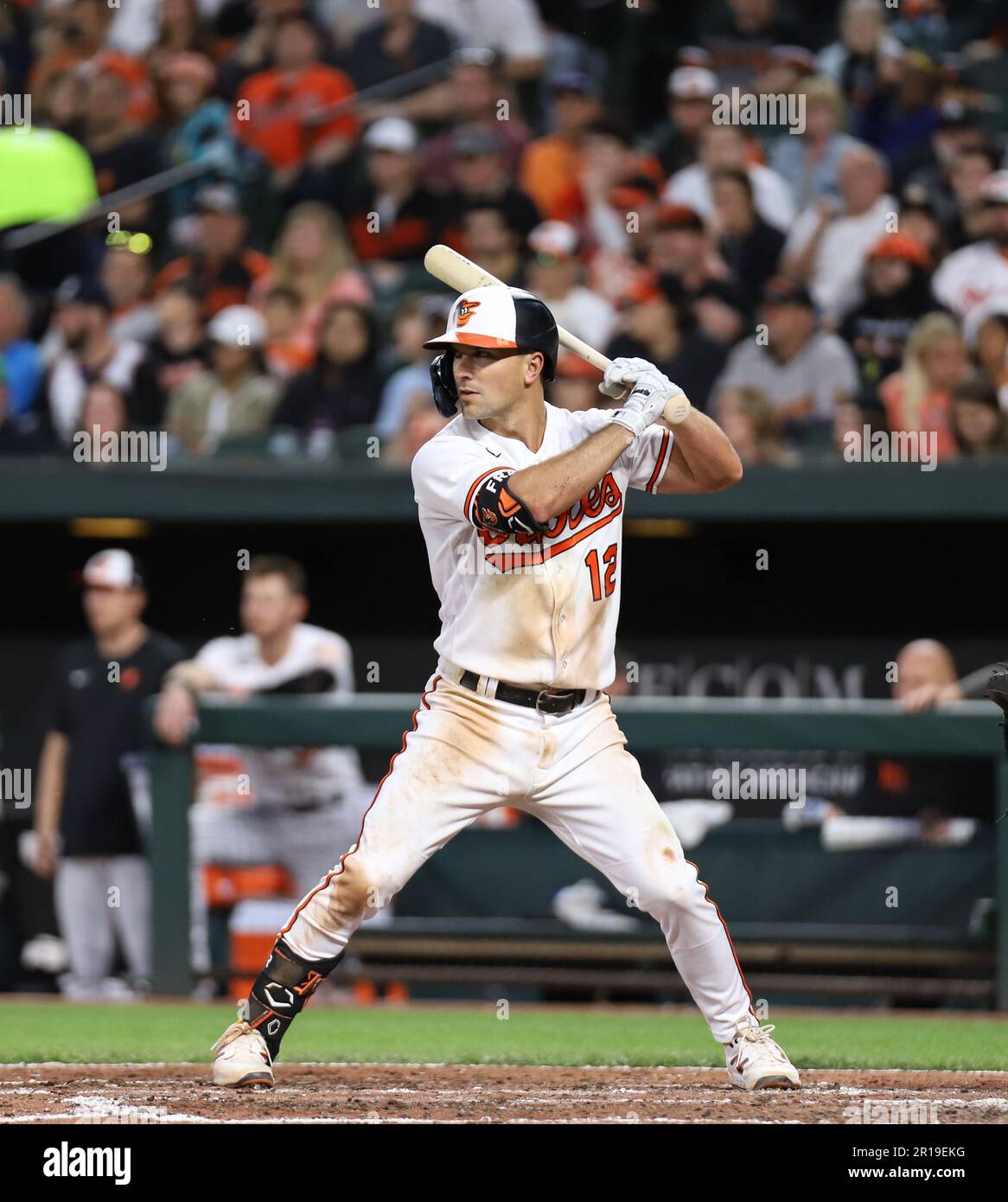 Baltimore Orioles' second baseman Adam Frazier (12) hits a ground ball into  a force play at second but makes it safely to first, driving in a run in  the bottom of the