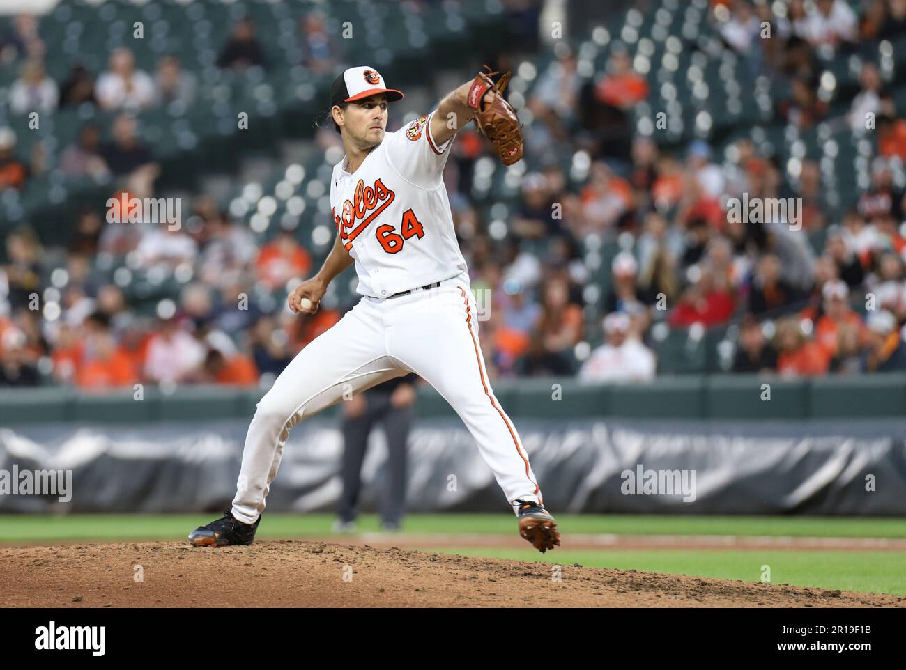 Baltimore Orioles' pitcher Dean Kremer (64) set to release the pitch in