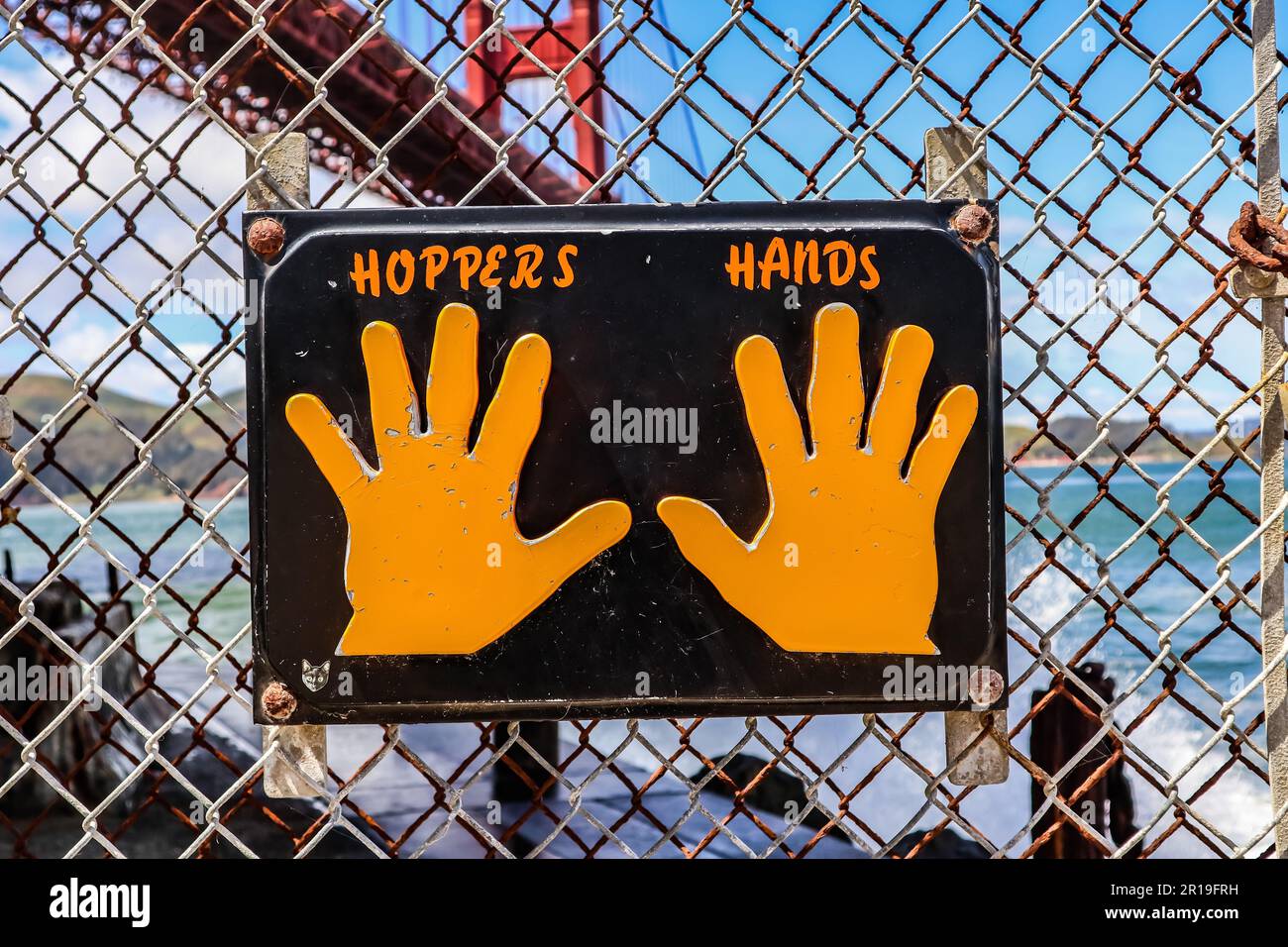 The hopper's hands by the Golden Gate Bridge at Fort Point Stock Photo