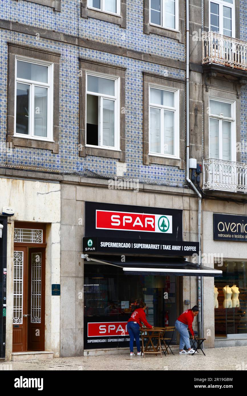 Staff preparing to open Spar supermarket in old building on Praça de Carlos Alberto, Porto / Oporto, Portugal Stock Photo