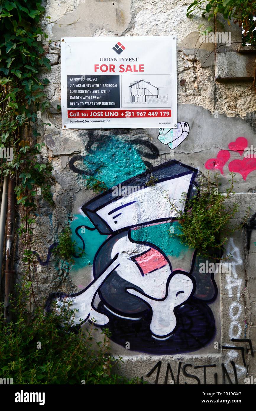 For sale sign for approved redevelopment project on ruined building on Rua da Sra das Verdades street, Ribeira district, Porto / Oporto, Portugal Stock Photo