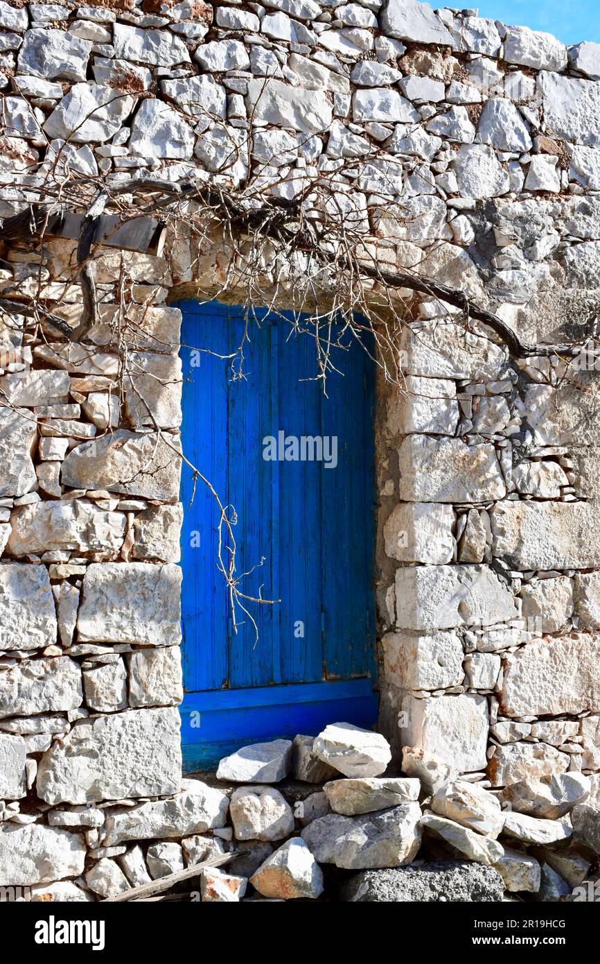 Blue window shutters in white stone house Stock Photo - Alamy