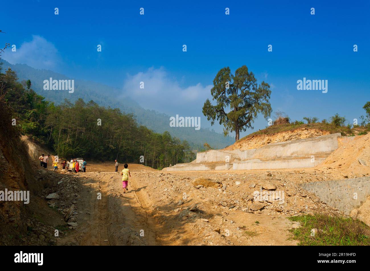 High altitude playground and stadium is being made by cutting tree and levelling Himalayan soil, Environmental damage to Himalayan mountains. Stock Photo