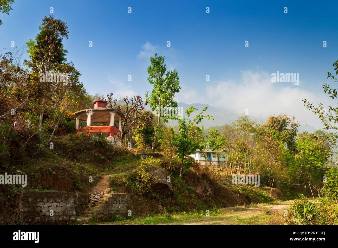 A small high altitude village at Trekking route through mountains towards Varsey Rhododendron Sanctuary or Barsey Rhododendron Sanctuary. Stock Photo