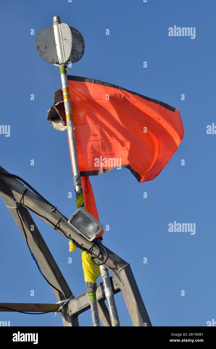 danbuoy flag flying over beached longshore fishing boat aldeburgh suffolk england Stock Photo