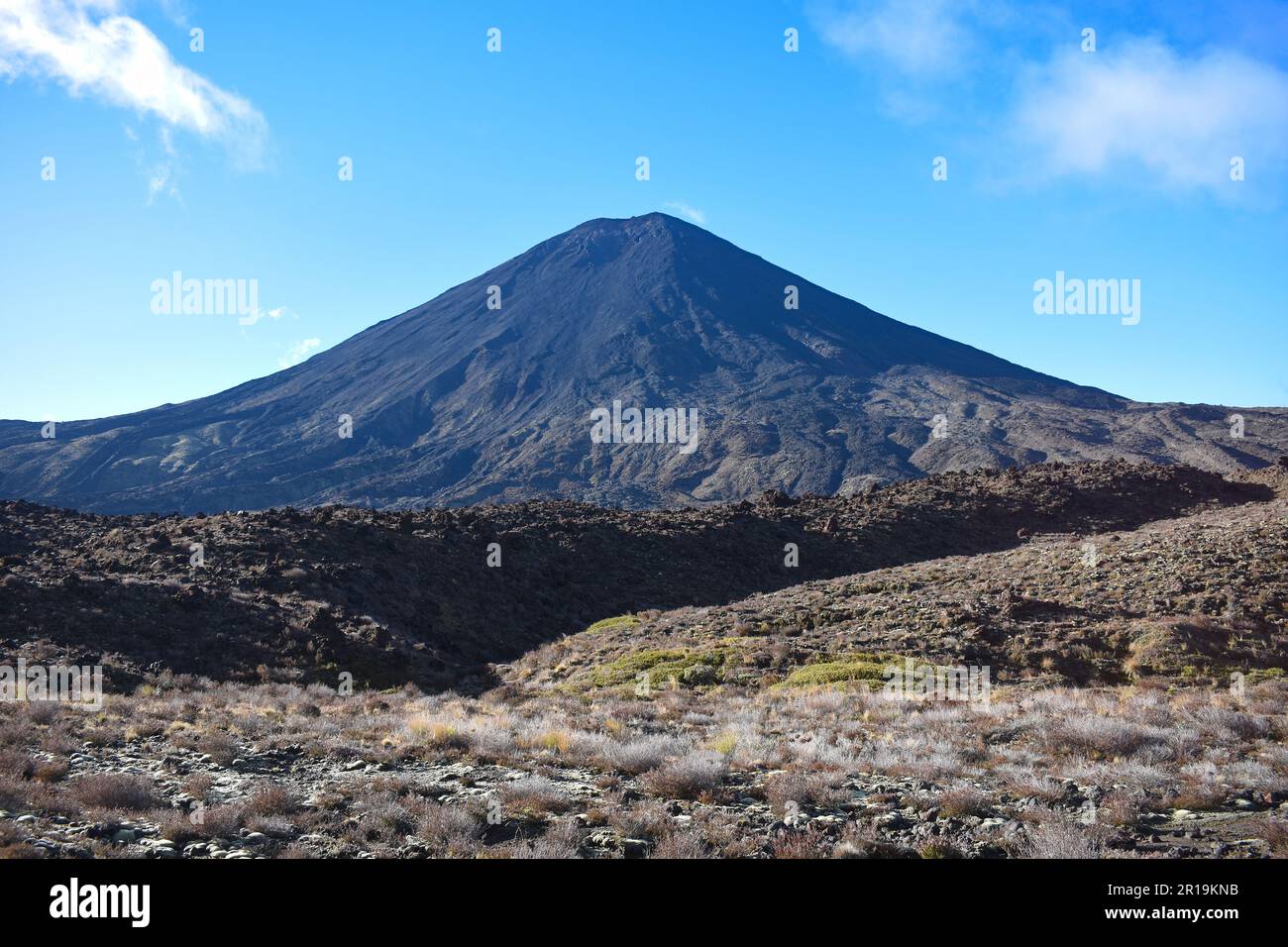 View of the Mt Ngauruhoe (Mount Doom) volcanic cone from the trekking route of the Tongariro Alpine Crossing trail on the North Island of New Zealand. Stock Photo