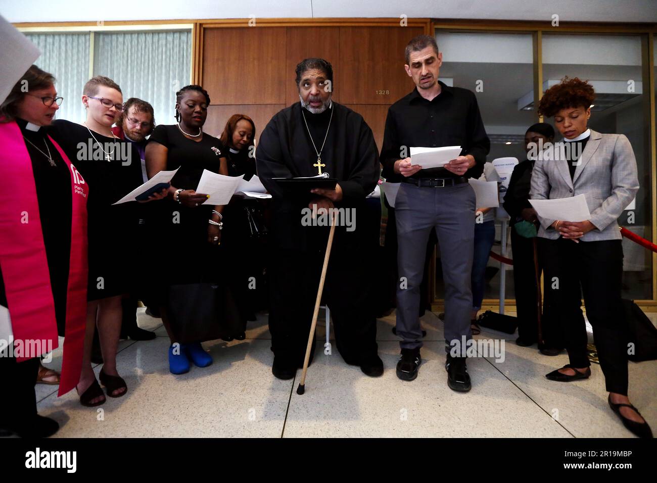 Raleigh, North Carolina, USA. 12th May, 2023. Rev. Dr. WILLIAM BARBER, c, President of the Repairers of the Breach and the Poor People's Campaign leads over two dozen clergy from all faith communities, reading aloud a letter addressed to the leadership of the NC General Assembly, asking for them to stand in solidarity against policies of the GOP against fundamental rights of a woman's right to choose. (Credit Image: © Bob Karp/ZUMA Press Wire) EDITORIAL USAGE ONLY! Not for Commercial USAGE! Stock Photo