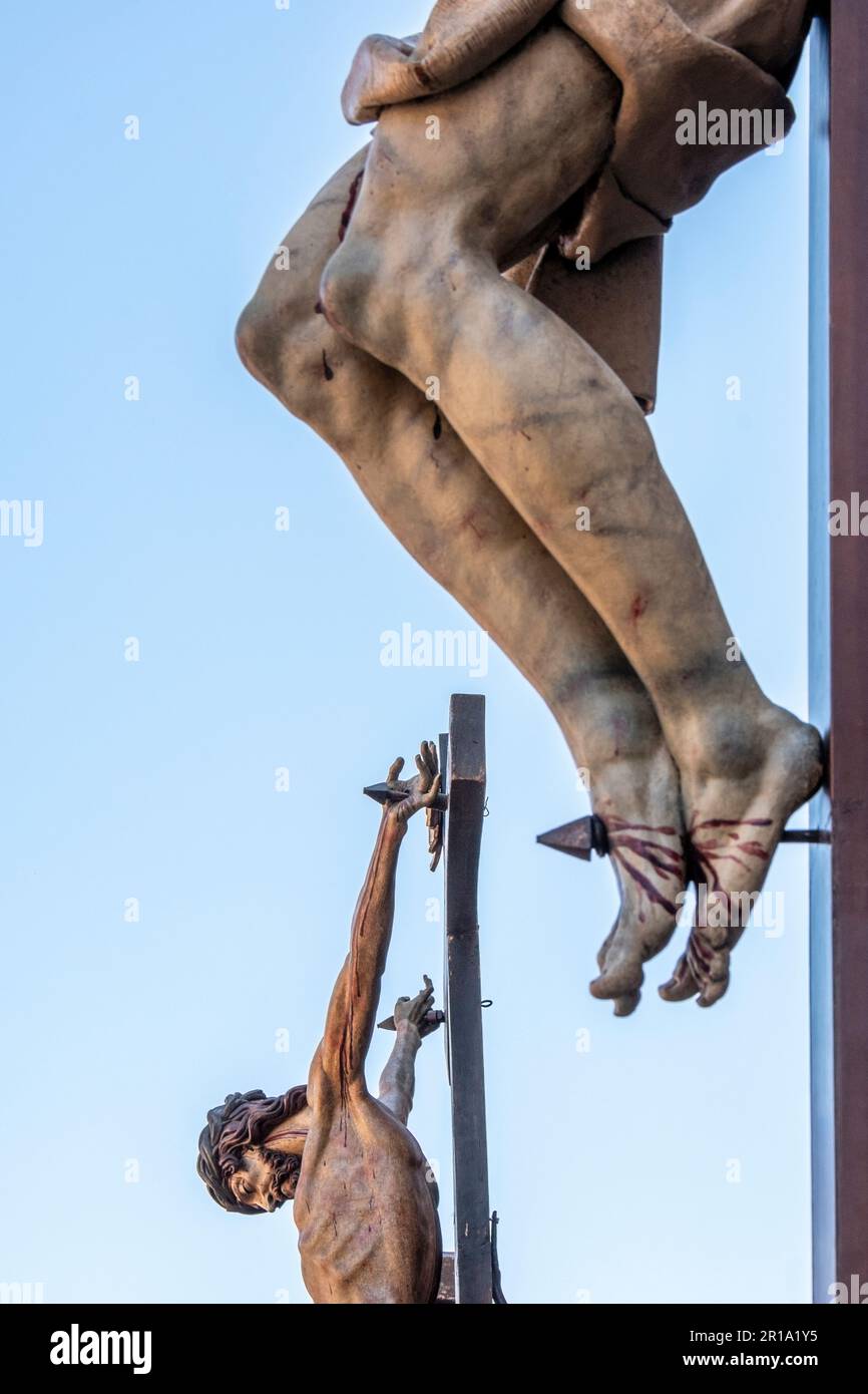 Statues of a crucified Jesus gathered in Plaza Mayor during Semana Santa in Valladolid, Spain Stock Photo