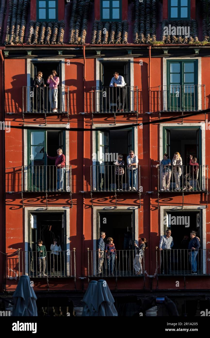 Spectators watch Semana Santa processions from their balconies in Plaza Mayor, Valladolid, Spain Stock Photo
