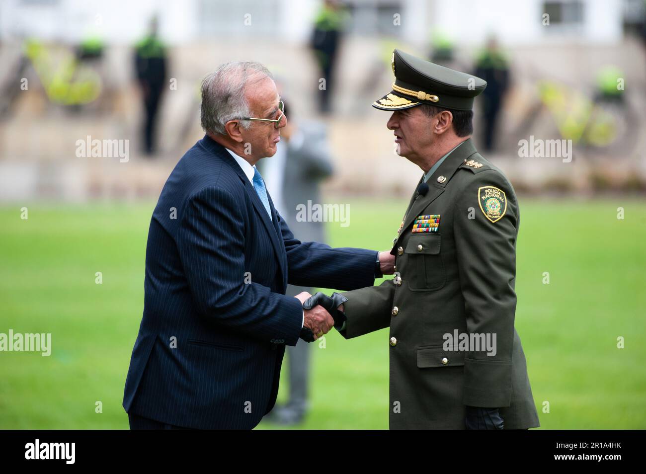 Colombian police outgoing director, general Henry Sanabria Cely receives condecorations from Colombian defense minister Ivan Velasquez during the cere Stock Photo