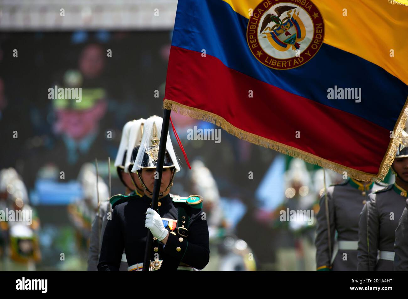 Colombian police cadets wave the Colombian flag during the ceremony of the new Colombian Police Director William Rene Salamanca at the General Santand Stock Photo