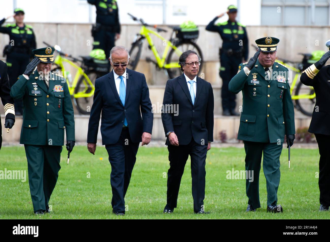 Colombian president Gustavo Petro marches along miniser of defense Ivan Velasquez and the Joint Chiefs of Staff during the ceremony of the new Colombi Stock Photo