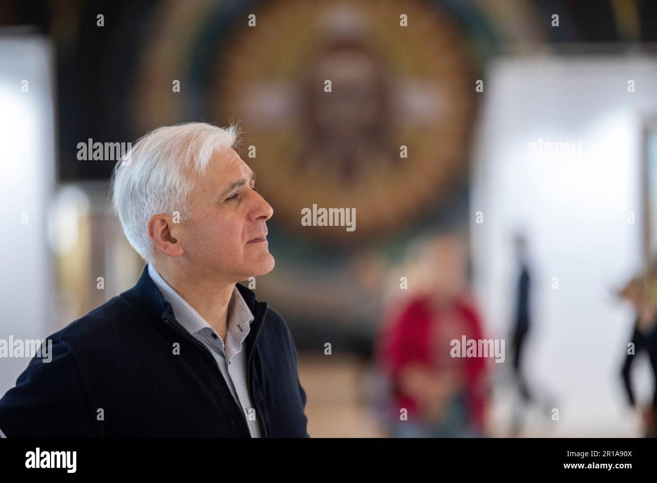 Moscow, Russia. 12th May, 2023. Artist Vasily Nesterenko at the exhibition of his works 'We are Russians, God is with us!' in the Central Exhibition Hall 'Manege' in Moscow, Russia. Stock Photo