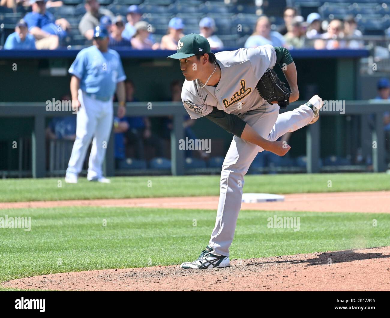 Shintaro Fujinami of the Oakland Athletics pitches against the Milwaukee  Brewers in a spring training game