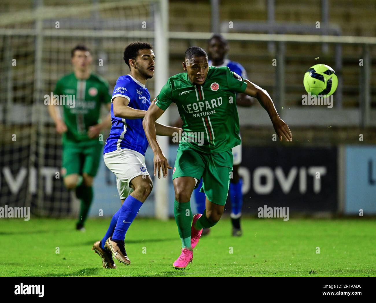 Virton, Belgium. 12th May, 2023. Jong Genk's Tuur Rommens and Virton's  Yannick Selim Aguemon fight for the ball during a soccer match between  Royal Excelsior Virton and Jong Genk, Friday 12 May