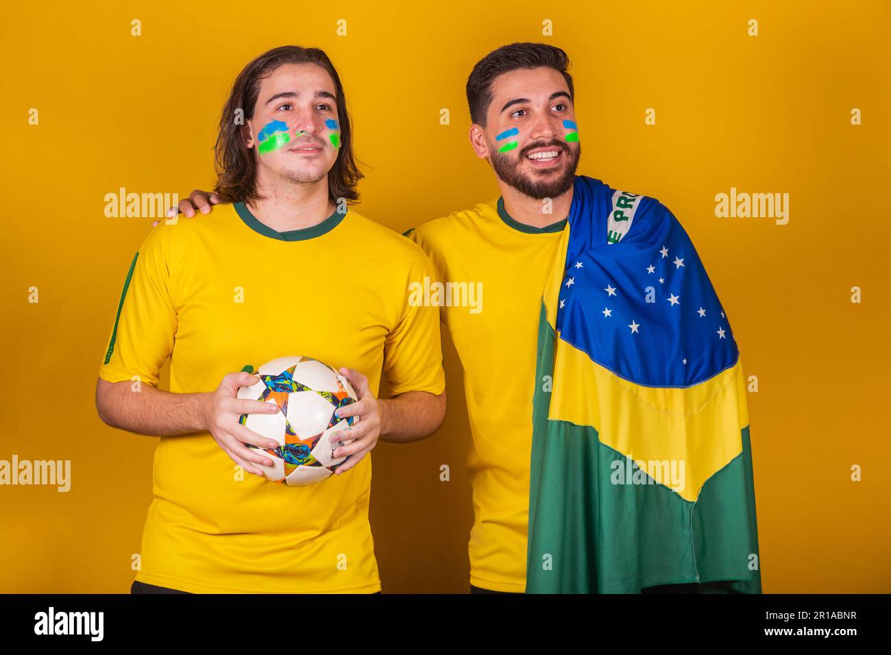Brazilian friends, latin americans, diversity, cheering for brazil, in the 2022 world cup, attentive and thinking, paying attention to the game Stock Photo