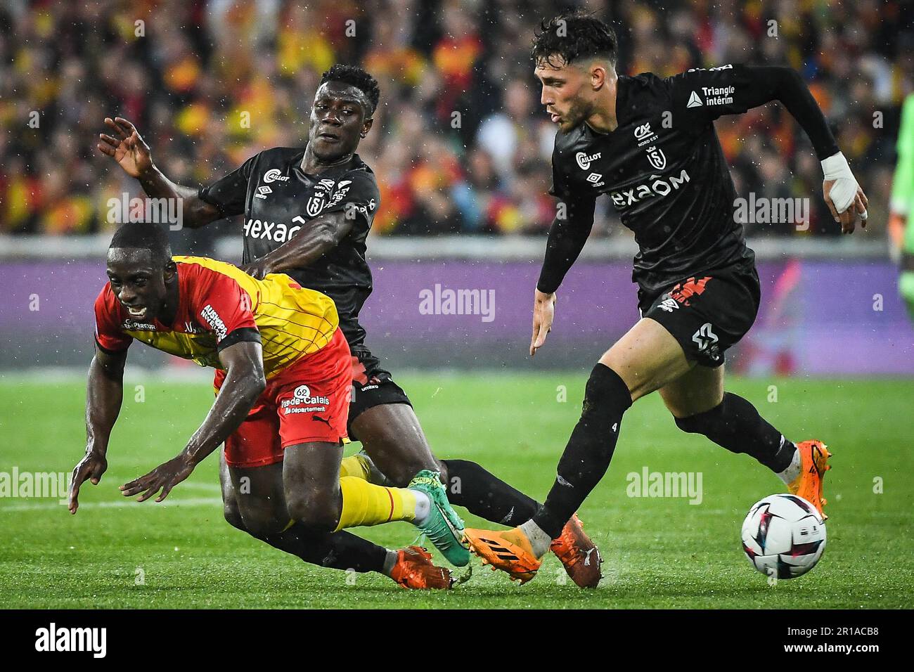 Deiver MACHADO of Lens, Azor MATUSIWA of Reims and Maxime BUSI of Reims  during the French championship Ligue 1 football match between RC Lens and  Stade de Reims on May 12, 2023