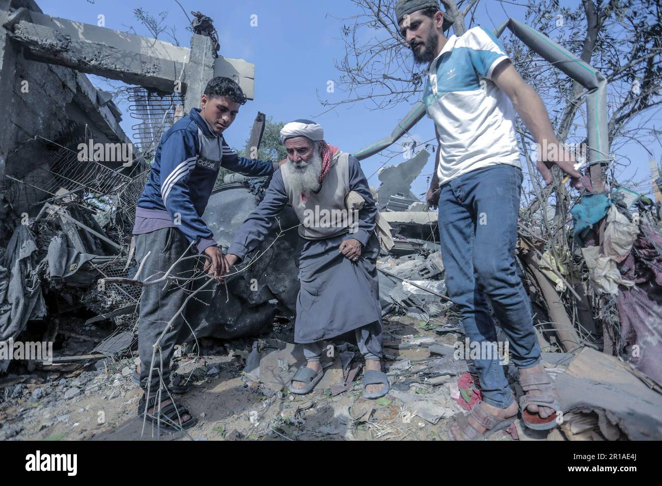 Gaza, Palestine. 12th May, 2023. Palestinians Inspect The Wreckage Of A ...