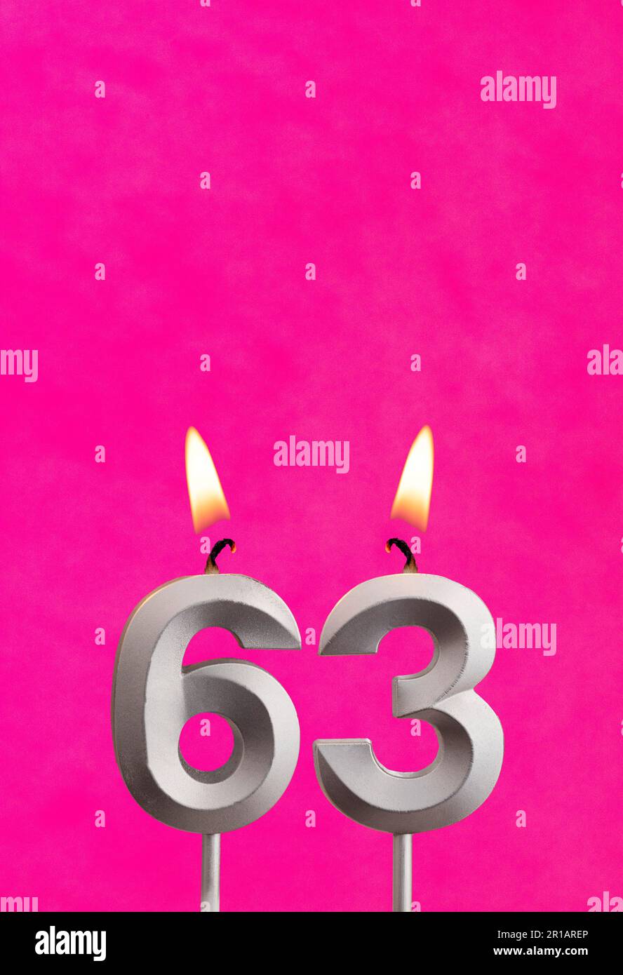 Number 63 candle - Birthday celebration on fuchsia background Stock ...