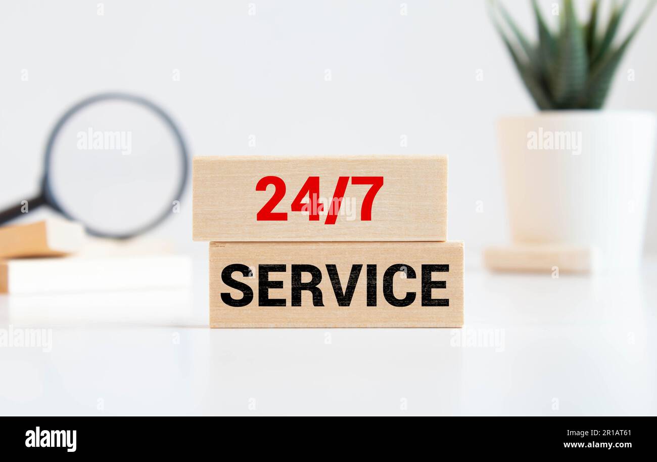 Open seven days a week, 24 hours a day. 247 green sign working around the clock hanging on dark