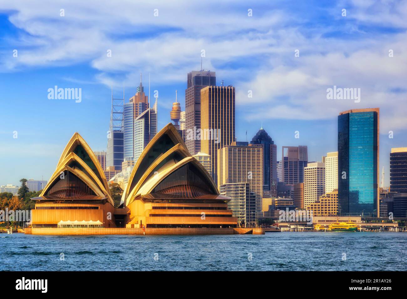 Sydney city CBD landmarks across Sydney Harbour in soft morning light - modern architecture of Australia. Stock Photo