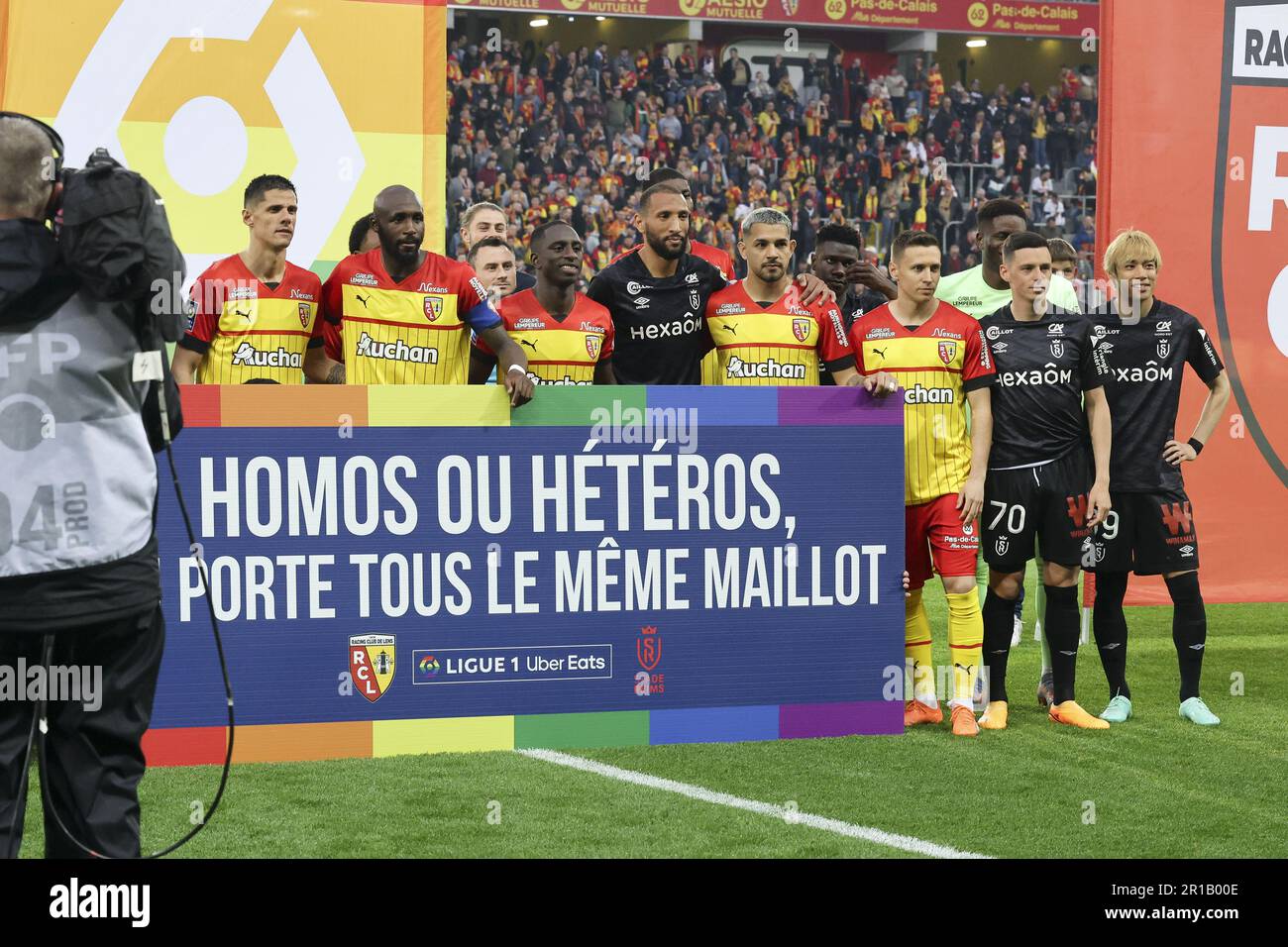 Both teams together behind a banner supporting gay rights before the French championship Ligue 1 football match between RC Lens and Stade de Reims on May 12, 2023 at Stade Bollaert-Delelis in Lens, France - Photo: Jean Catuffe/DPPI/LiveMedia Stock Photo