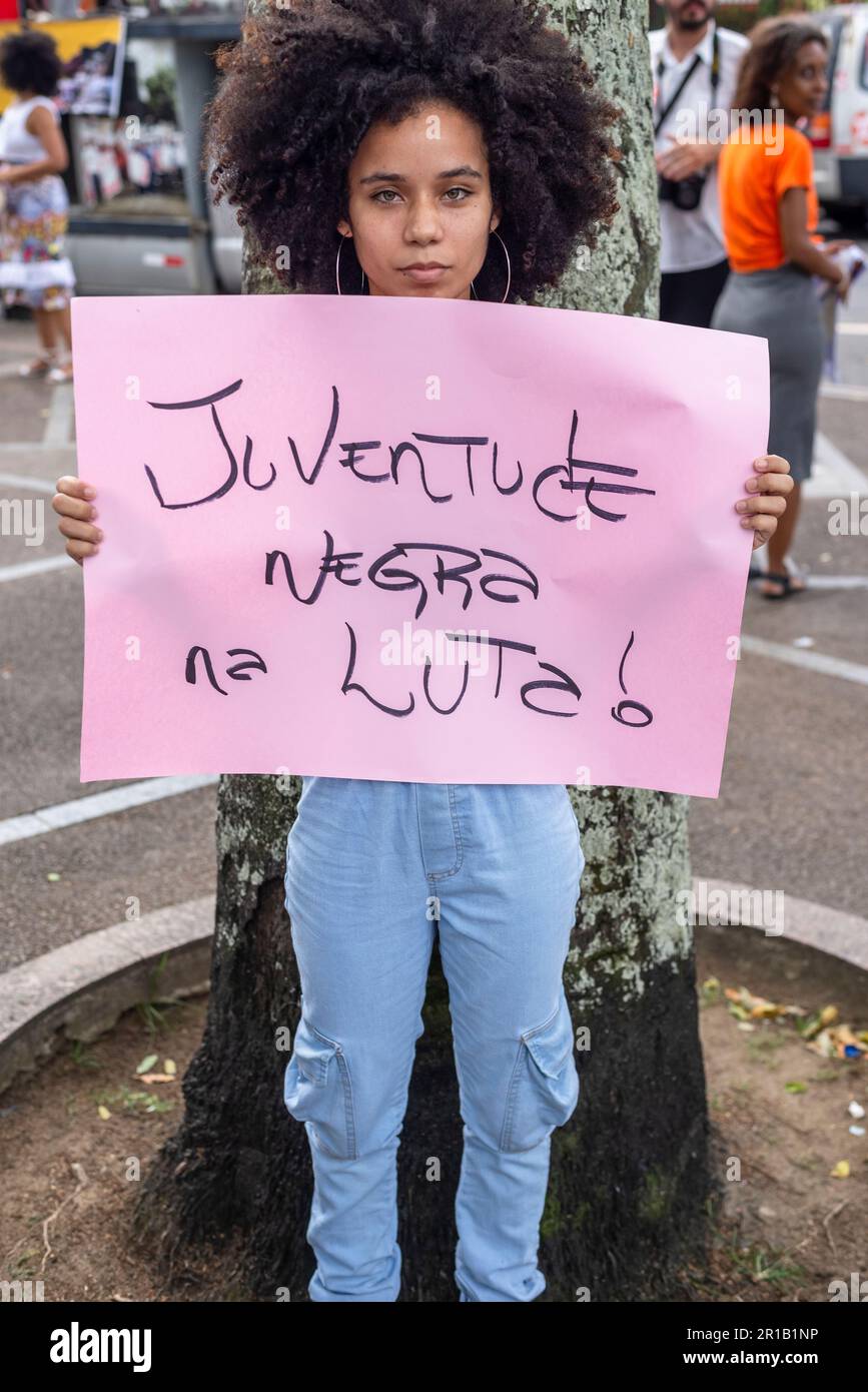 Salvador, Bahia, Brazil - October 29, 2022: Young people are seen with protest signs at the Marcha do Empoderamento Crespo, in the city of Salvador, B Stock Photo