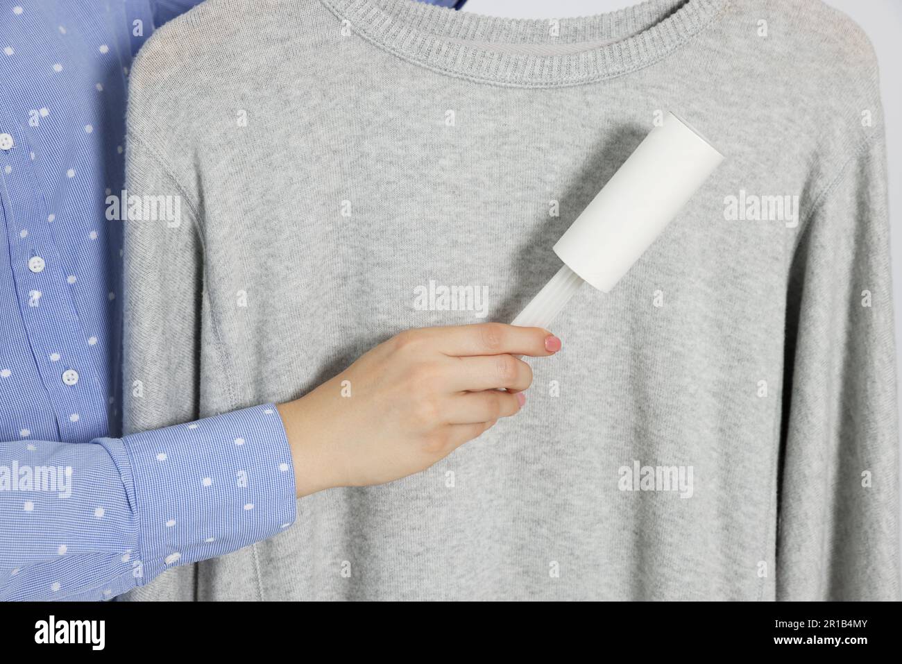 Woman removing her clothes hi-res stock photography and images - Alamy