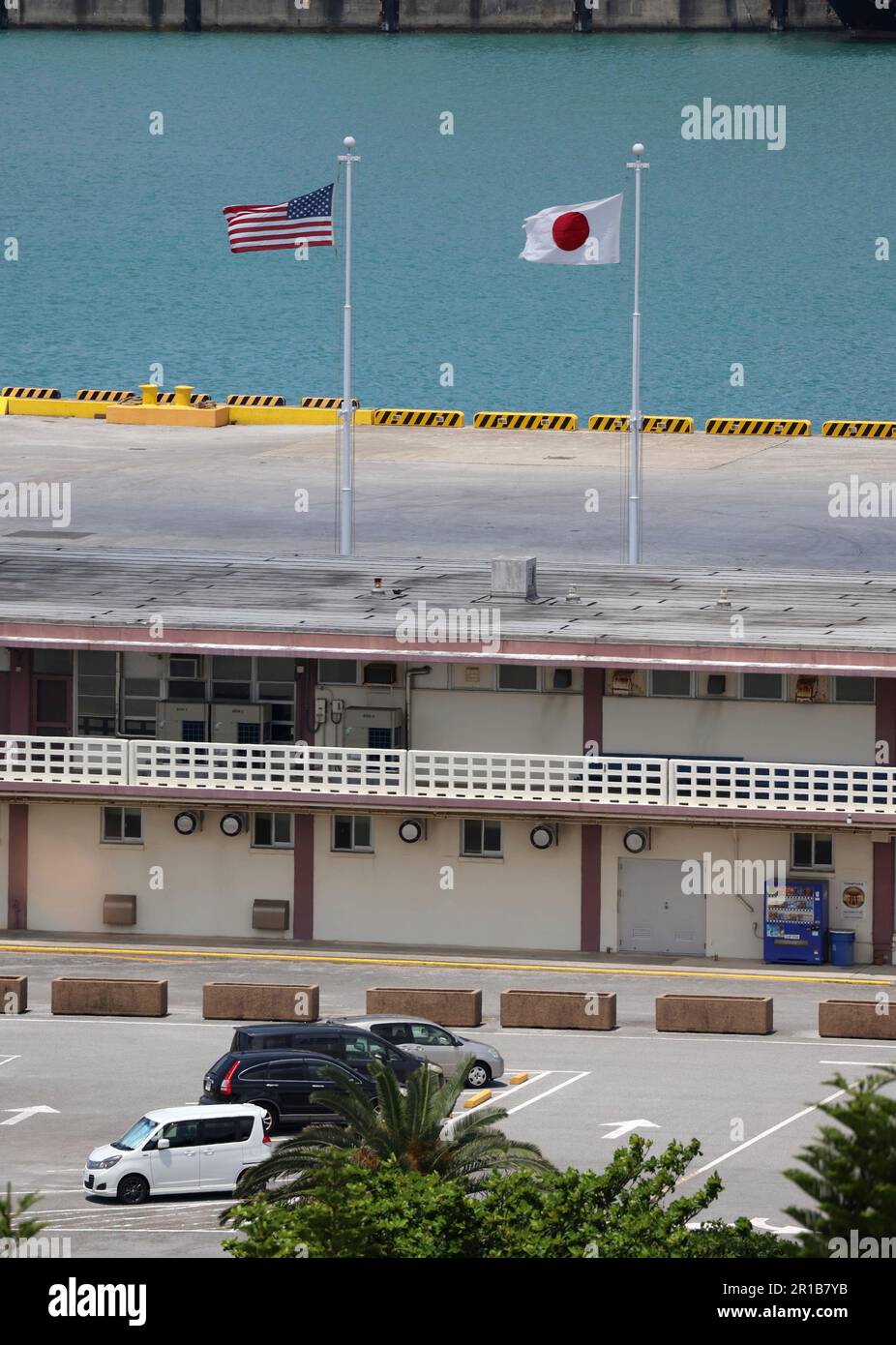 Flags of United States of America and Japan are rsised at Naha Port Facility in Naha City, Okinawa Prefecture on May 12, 2023. The port, also called Naha army port or Naha military port, is a United States Forces Japan facility. ( The Yomiuri Shimbun via AP Images ) Stock Photo