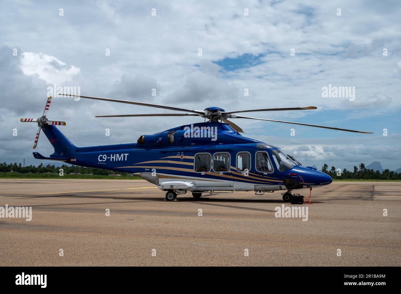 Leonardo (Augusta Westland) AW139 commercial helicopter C9-HMT parked on the apron of Nampula Airport in Mozambique Stock Photo