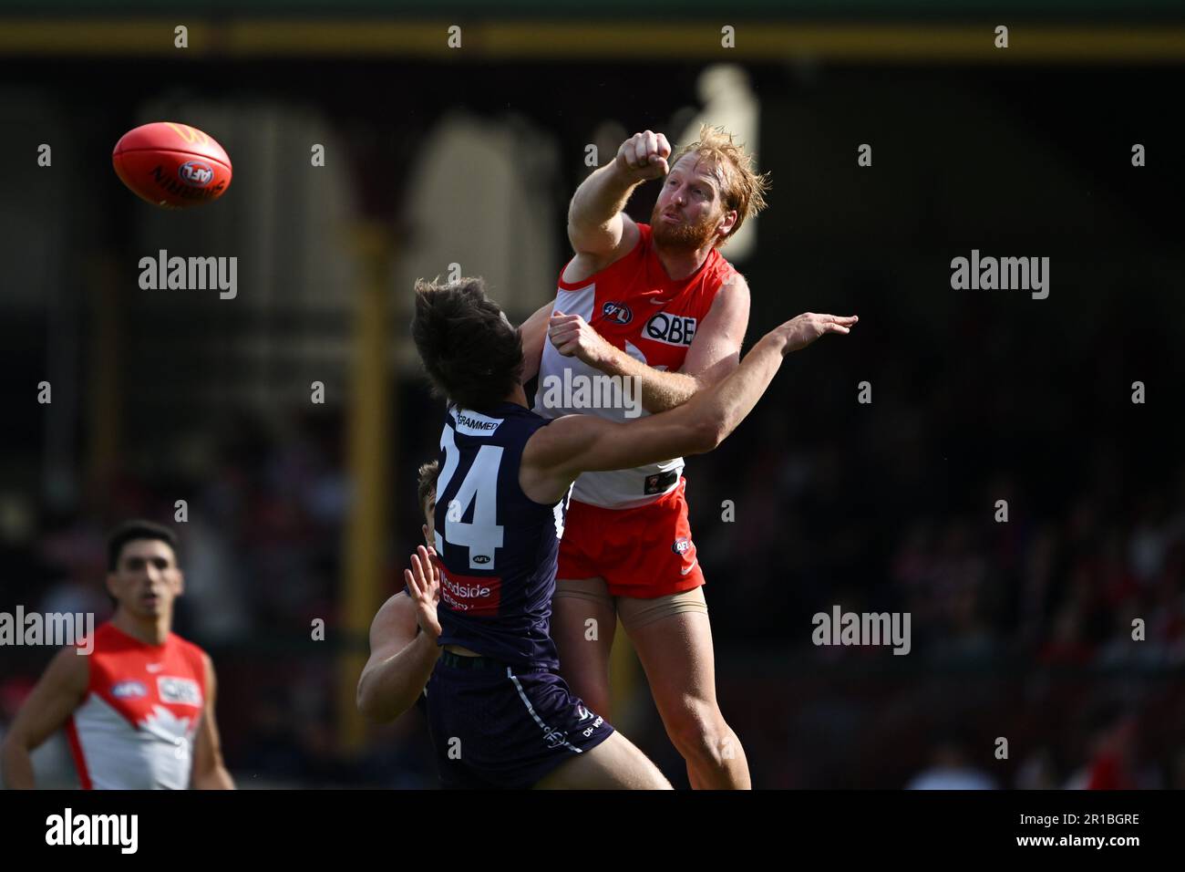 Aaron Francis of the Swans handballs during the AFL Round 9 match ...