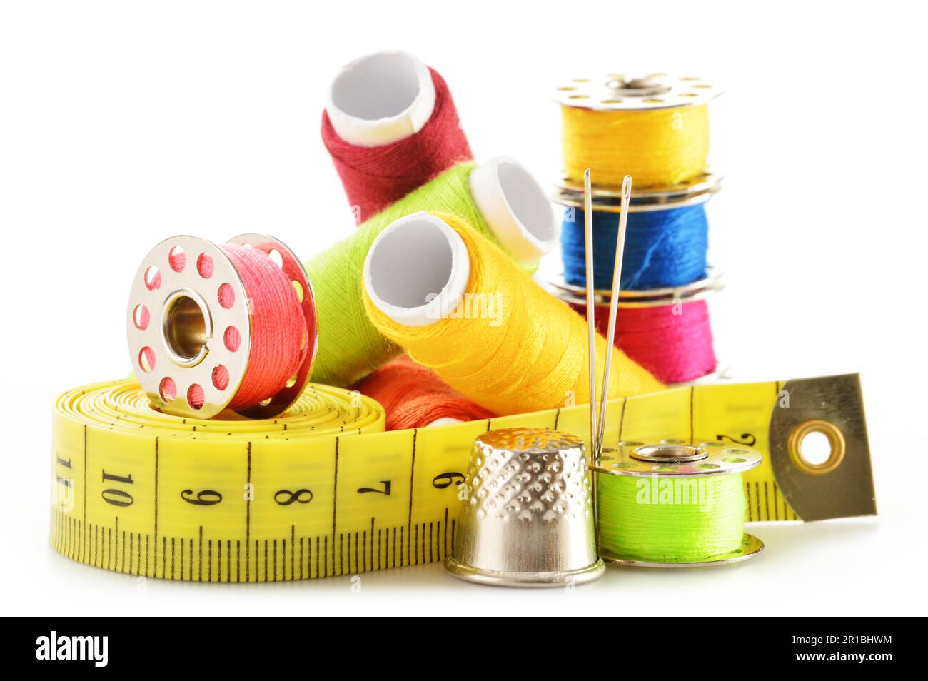 Composition with tailor needles and threads over white background Stock Photo