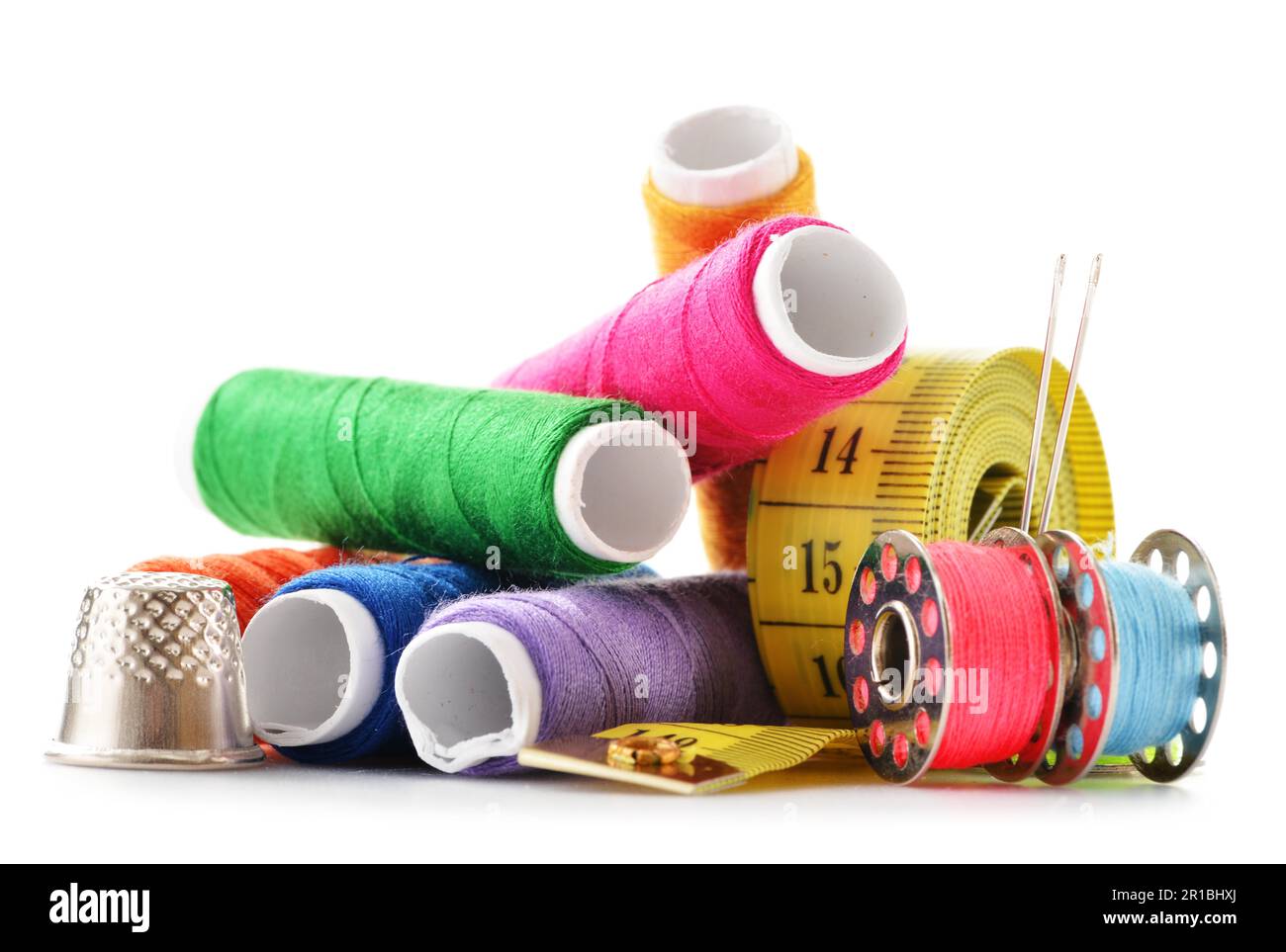 Composition with tailor needles and threads over white background Stock Photo