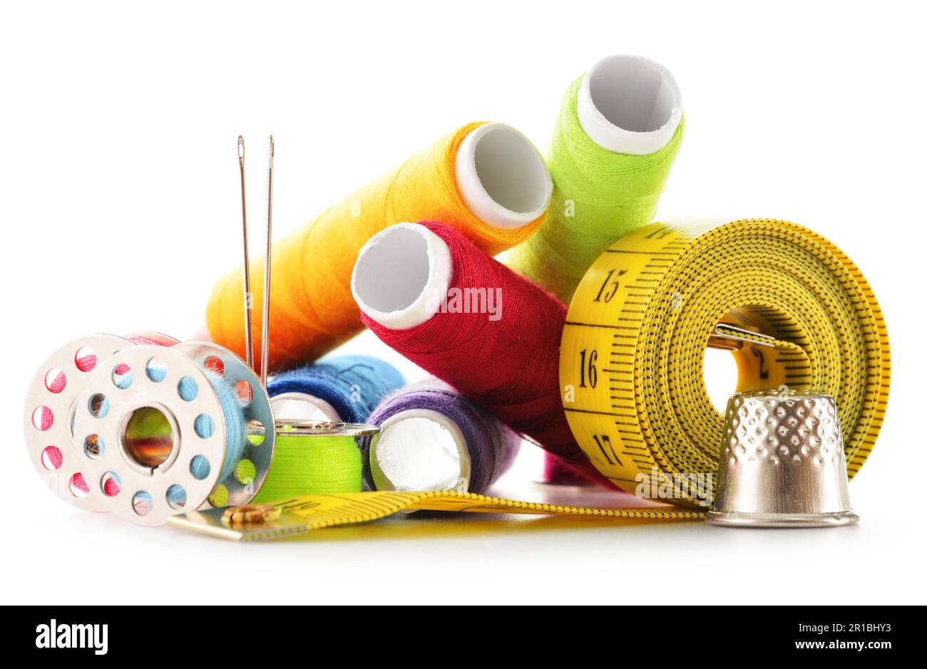 Composition with tailor needles and threads over white background Stock Photo