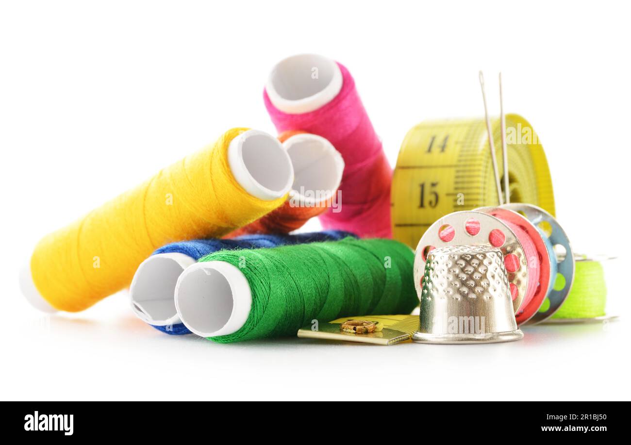 Composition with tailor needles and threads over white background Stock Photo