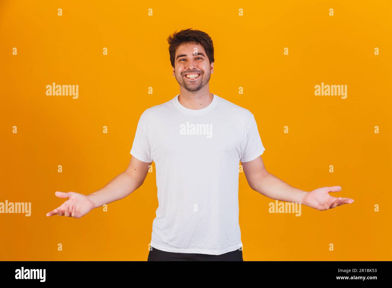 handsome man pointing to the side with space for text Stock Photo