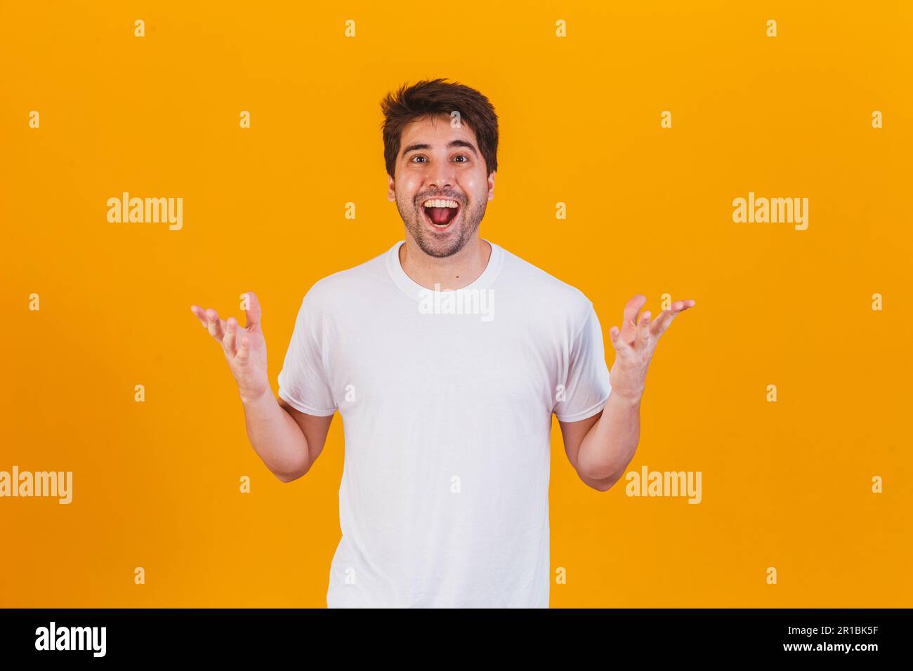 handsome man pointing to the side with space for text Stock Photo