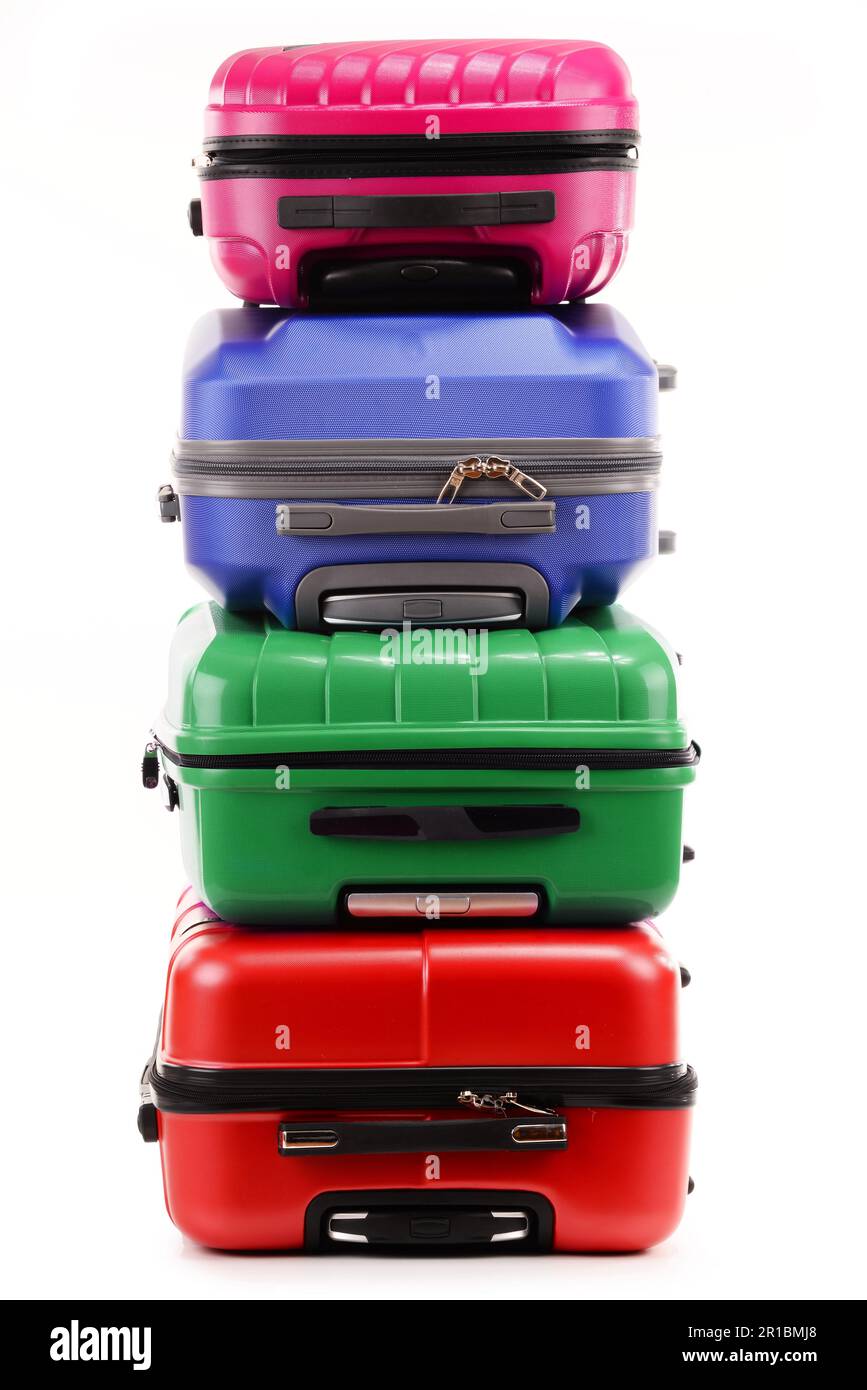 Stack of plastic suitcases isolated on white background Stock Photo Alamy