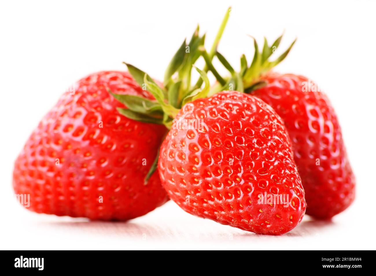 Fresh organic strawberries isolated on white background Stock Photo - Alamy