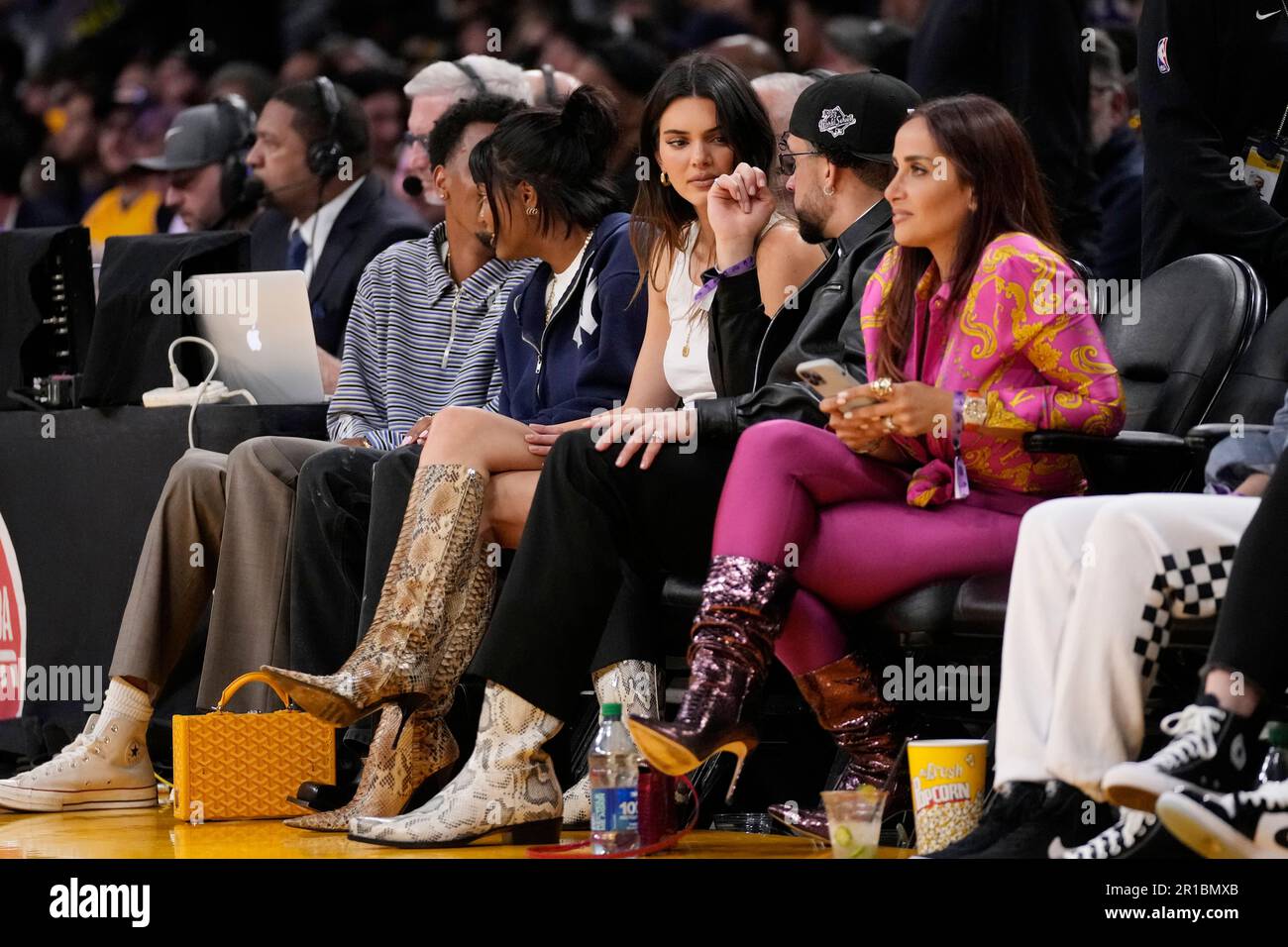Kendall Jenner, center, sits courtside with Bad Bunny during the second  half in Game 6 of an NBA basketball Western Conference semifinal series  between the Los Angeles Lakers and the Golden State