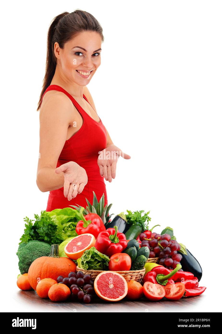 Young woman with variety of organic vegetables and fruits Stock Photo ...