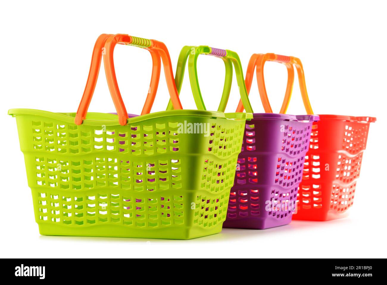 Three empty plastic shopping baskets isolated on white background Stock