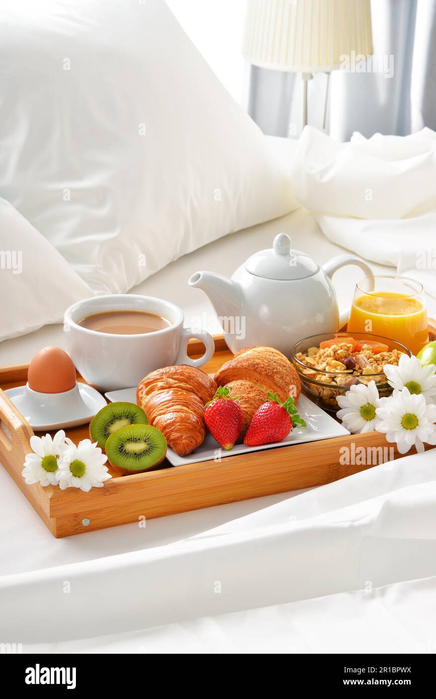 Breakfast tray in bed in hotel room Stock Photo - Alamy
