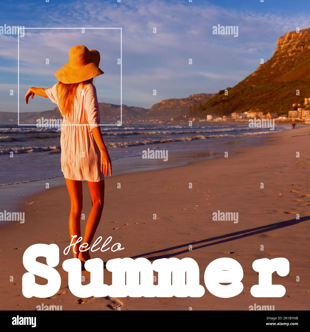 Composite of hello summer text and carefree caucasian young woman wearing hat standing at beach Stock Photo